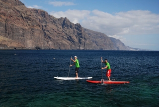 practicing paddle surfing 